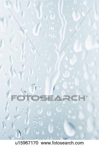Stock Image - Drops of rain on window. Fotosearch
