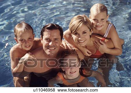 Family portrait in a pool View Large Photo Image Stock Photo - Family portrait in a pool. Fotosearch