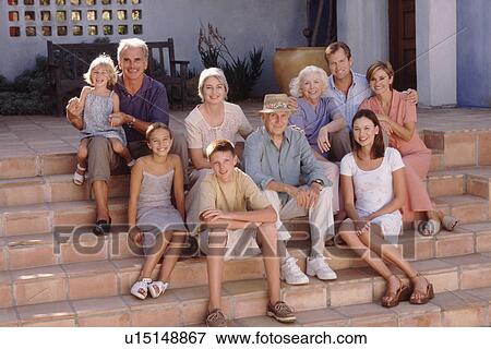Stock Photo - Family portrait on the steps. Fotosearch