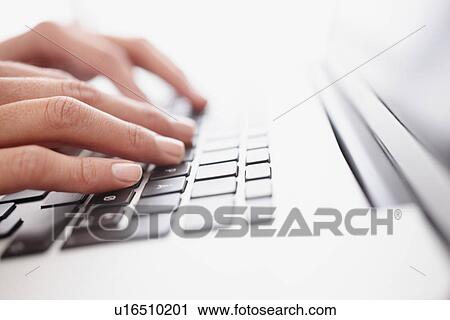Stock Image - Fingers typing on keyboard. Fotosearch