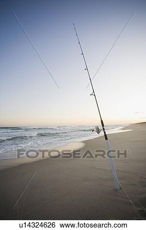 Fishing pole on the beach View Large Photo Image Stock Photograph - Fishing pole on the beach. Fotosearch