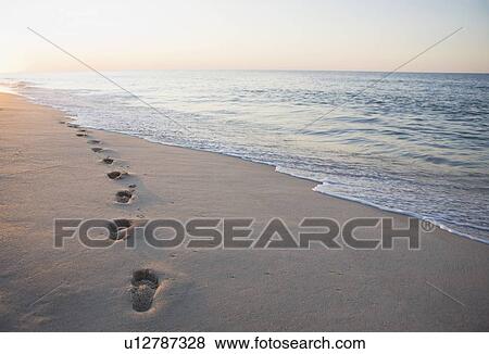 Stock Photo - Footprints in the sand. Fotosearch