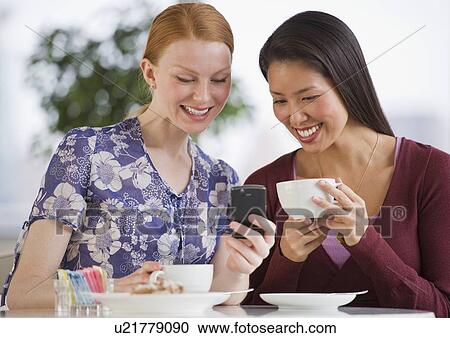 Friends at a cafe View Large Photo Image Stock Image - Friends at a cafe. Fotosearch