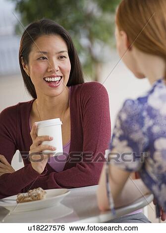 Friends at a cafe View Large Photo Image Stock Photograph - Friends at a cafe. Fotosearch