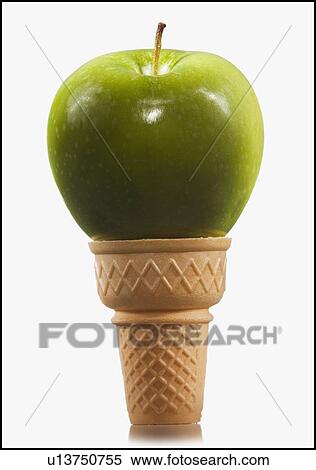 Stock Photography - Green apple in an ice cream cone. Fotosearch