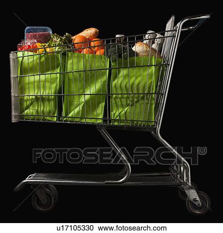 Stock Image - Grocery cart full of bags of groceries. Fotosearch