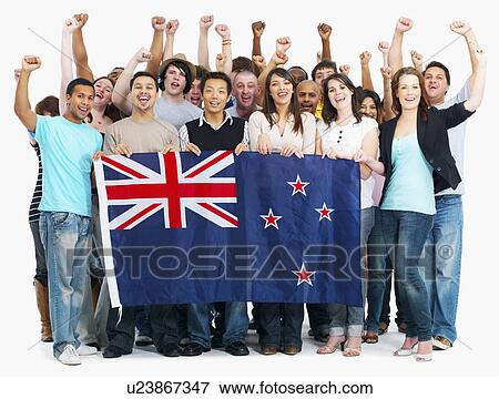 Stock Photo - Group of people holding Australian flag. Fotosearch