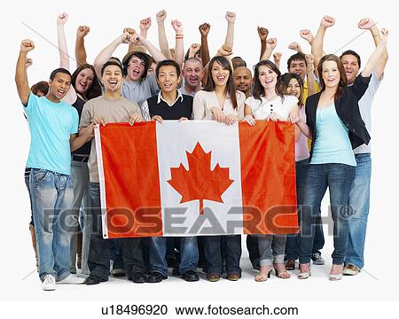 Group of people holding Canadian flag View Large Photo Image Stock Image - Group of people holding Canadian flag. Fotosearch