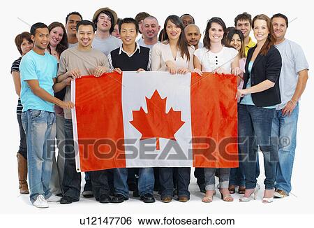 Group of people holding Canadian flag View Large Photo Image Stock Photograph - Group of people holding Canadian flag. Fotosearch