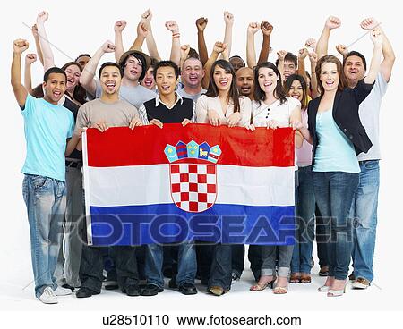 Stock Image - Group of people holding flag. Fotosearch