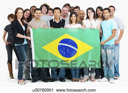 Stock Image - Group of people holding flag. Fotosearch