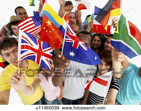 Stock Photo - Group of people holding flags. Fotosearch
