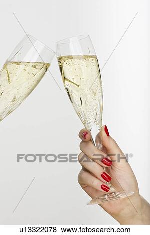 Hand holding champagne glass View Large Photo Image Stock Photo - Hand holding champagne glass. Fotosearch