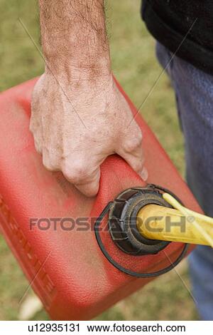 Hand holding gas can View Large Photo Image Stock Image - Hand holding gas can. Fotosearch