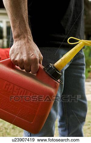 Hand holding gas can View Large Photo Image Stock Photo - Hand holding gas can. Fotosearch
