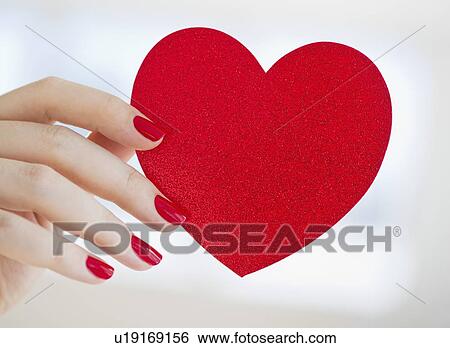 Hand holding red heart View Large Photo Image Stock Photograph - Hand holding red heart. Fotosearch