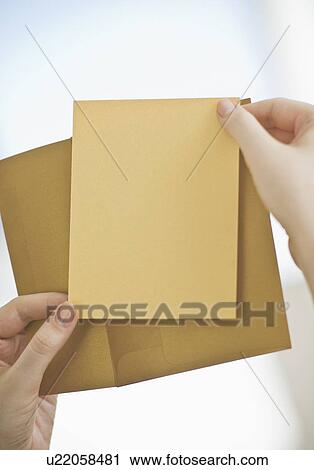 Stock Image - Hands holding a blank card. Fotosearch
