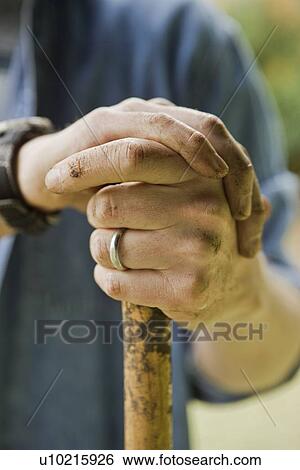 Hands holding shovel View Large Photo Image Stock Photograph - Hands holding shovel. Fotosearch