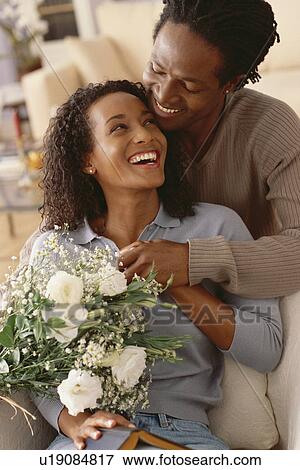 Stock Photo - Happy couple embracing. Fotosearch