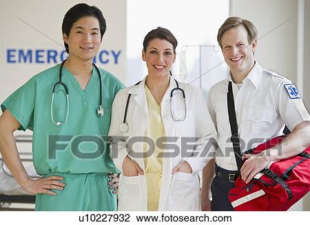 Stock Image - Healthcare workers in emergency room. Fotosearch