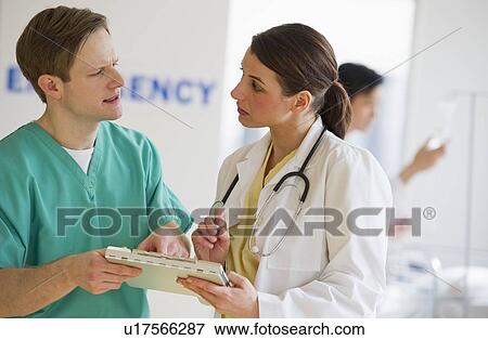 Stock Photo - Healthcare workers talking. Fotosearch