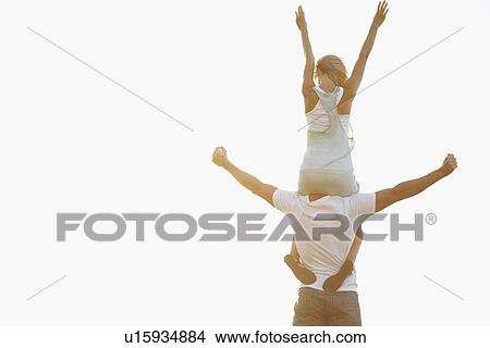 Man carrying woman on his shoulders View Large Photo Image Picture - Man carrying woman on his shoulders. Fotosearch