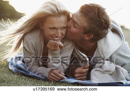 Man kissing girlfriend View Large Photo Image Stock Photo - Man kissing girlfriend. Fotosearch