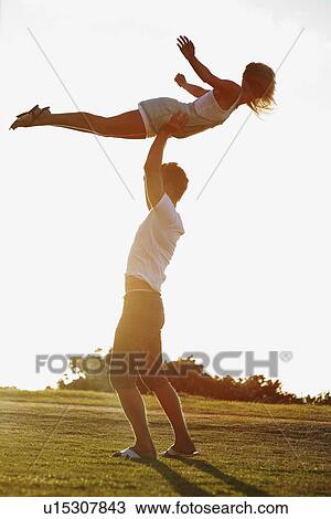 Man lifting girlfriend View Large Photo Image Stock Image - Man lifting girlfriend. Fotosearch