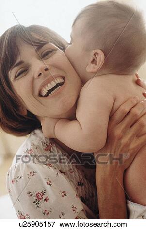 Stock Photo - Mother embracing her baby. Fotosearch