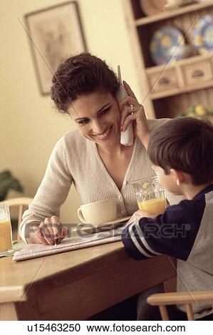 Multi tasking mother View Large Photo Image Stock Image - Multi tasking mother. Fotosearch