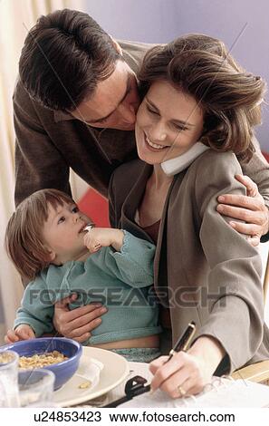 Stock Image - Multi tasking mother. Fotosearch