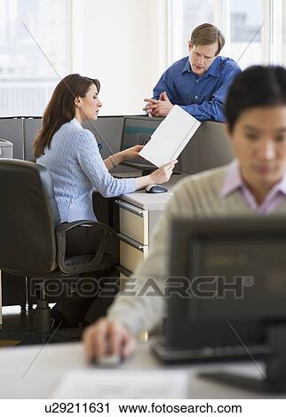 Stock Image - Office workers in cubicles. Fotosearch