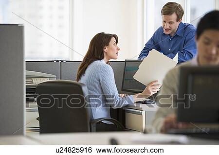 Stock Photograph - Office workers in cubicles. Fotosearch