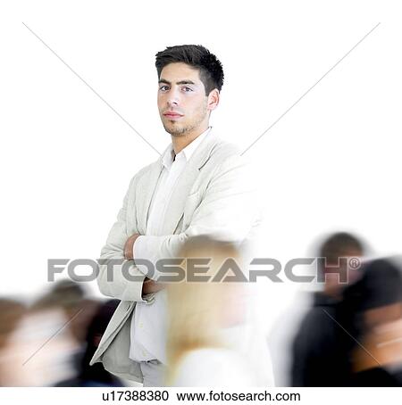 One person standing amongst a blur of other people View Large Photo Image Stock Image - One person standing amongst a blur of other people. Fotosearch