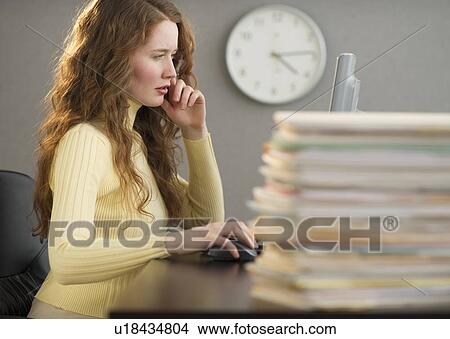 Overworked woman in cubicle View Large Photo Image Picture - Overworked woman in cubicle. Fotosearch