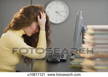 Overworked woman in cubicle View Large Photo Image Stock Image - Overworked woman in cubicle. Fotosearch