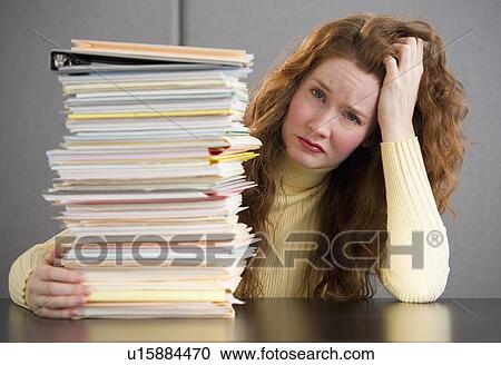 Overworked woman in cubicle View Large Photo Image Stock Image - Overworked woman in cubicle. Fotosearch