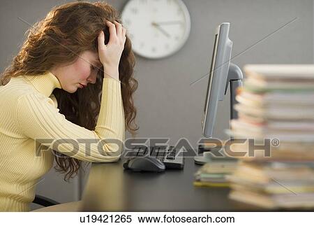 Overworked woman in cubicle View Large Photo Image Stock Photography - Overworked woman in cubicle. Fotosearch