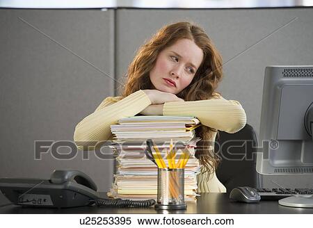 Overworked woman in cubicle View Large Photo Image Stock Photography - Overworked woman in cubicle. Fotosearch