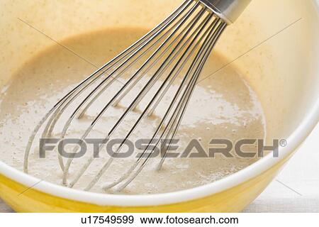 Stock Photo - Pancake batter and whisk in mixing bowl. Fotosearch