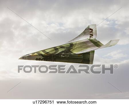 Stock Image - Paper airplane made out of money. Fotosearch