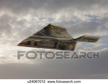 Paper airplane made out of money View Large Photo Image Stock Image - Paper airplane made out of money. Fotosearch