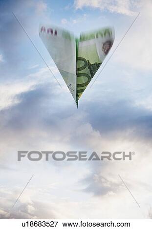 Paper airplane made out of money View Large Photo Image Stock Photo - Paper airplane made out of money. Fotosearch