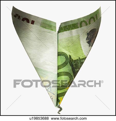 Stock Photo - Paper airplane made out of money. Fotosearch