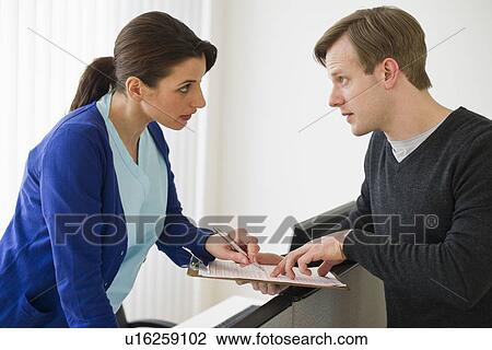 Patient talking to nurse View Large Photo Image Stock Image - Patient talking to nurse. Fotosearch