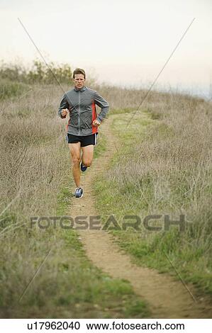 Person running on trail View Large Photo Image Stock Image - Person running on trail. Fotosearch
