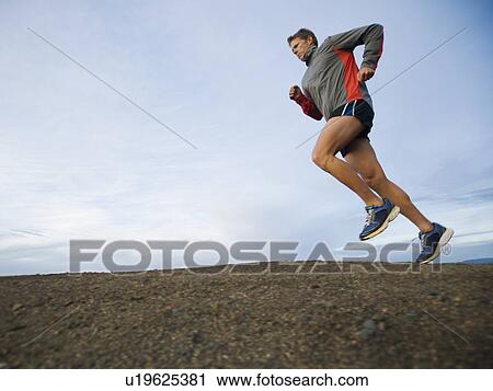 Person running on trail View Large Photo Image Stock Image - Person running on trail. Fotosearch