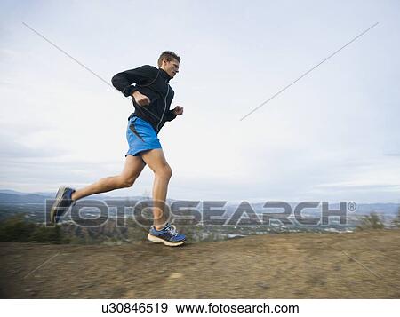 Person running on trail View Large Photo Image Stock Photo - Person running on trail. Fotosearch