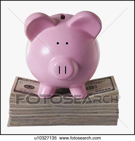 Stock Photography - Piggy bank on top of a pile of money. Fotosearch