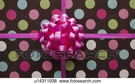 Pink bow on a gift View Large Photo Image Stock Photo - Pink bow on a gift. Fotosearch
